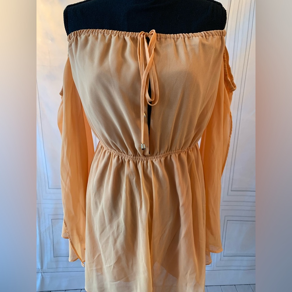light airy peach romper for a night out. Has never been worn.
